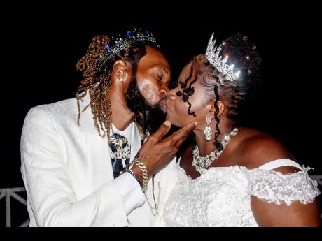 This photo of dancer Black Blingaz (left) and his bride Diamond Kelly had persons thinking that LA Lewis had tied the knot.
