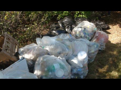 Some of the waste, including plastic bottles, that was cleared from sections of the Kingston Harbour on Saturday.