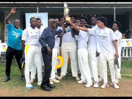 Bridgeport’s members celebrate winning their third consecutive Jamaica Energy Partner 40-over St Catherine cricket title with St Catherine Cricket Association President Milholland Barker (fourth left) after a 72-run victory over Old Harbour in the final at Port Esquivel recently.