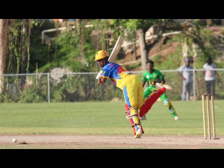 St Elizabeth Technical High School batsman Odane Binns plays through the leg side to gather runs and leads them to victory over Excelsior High.