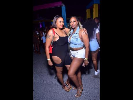 Sandy Unstoppable (left) and her sister Shawn chilling out at 90s Pon Di Wharf, held recently at Newport Commercial Centre, Newport West, Kingston. 