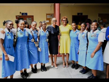Education Minister Fayval Williams (fifth left) with students of Merle Grove High School, St Andrew, and their teacher, Loretta Ricketts, at the national church service to mark the start of Child Month.