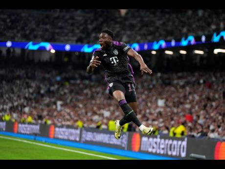 Bayern Munich’s Alphonso Davies celebrates after scoring during yesterday’s Champions League semi-final second-leg football match at the Santiago Bernabeu stadium in Madrid, Spain. Madrid won 2-1 to advance to the final 4-3 on aggregate.