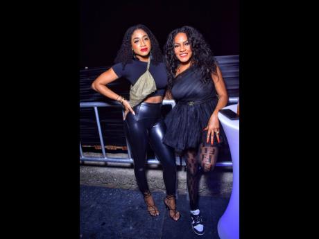 Blair Milan (left) and Mel hang out at  YBL All-Black Anniversary held in Harbour View, St Andrew, recently.