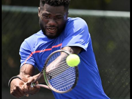 Ghana’s Abraham Asaba plays a forehand shot to United States of America’s Mitchell Dobek during their International Tennis Federation (ITF) World Tennis M15000 tournament at the Eric Bell Tennis Centre in Kingston yesterday. Asaba won 6-1, 6-1.