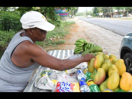 Credit: Ian Allen Miss Tiny, a stalwart fruit vendor, reflects on her dwindling sales.