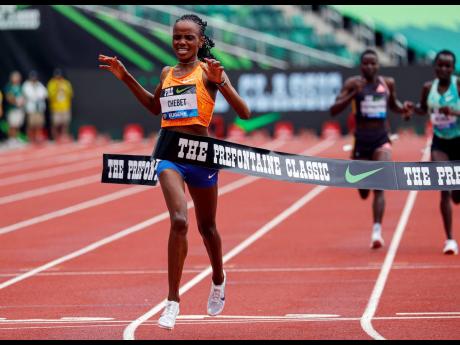 Beatrice Chebet of Kenya sets a world record in the 10,000m with a time of 28:54.14, during the Prefontaine Classic track and field meet last Saturday in Eugene, Oregon.