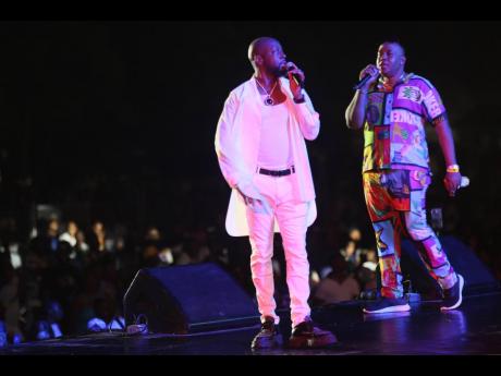 The night’s hosts, Wycleff Jean (left) and DJ Rhyme Up, tried to pump up the restless crowd who patiently waited for the show’s main acts to perform.