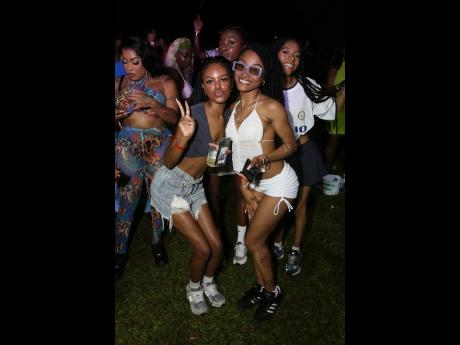 Partygoers Tori-Ann Thomas (left) and Ahjanae Johnson said they were feeling "Sashi cool" as the skimpily dressed ladies bounced to the sound of Jadakiss 