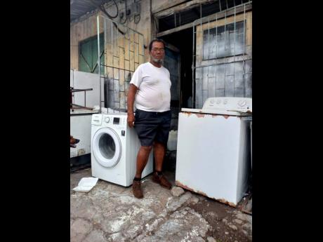 Credit: Kallejhay Terrelonge Though he is now in his 70s, Winston Anderson still repairs a wide variety of machines at his shop.