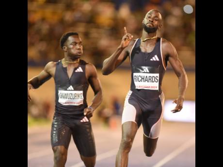 Jereem Richards (right) reacts after winning the men’s 200 metres in 20.13 seconds ahead of American-born Nigerian  sprinter Udodi Onwuzurike (left), 20.27.