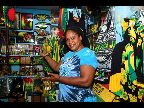 Credit: Antoine Lodge Judith Samuels shows off some of her creations inside her shop in the Kingston Craft Market.