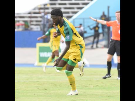 Reggae Boyz forward Shamar Nicholson celebrates  after scoring against the Dominican Republic during the 2026 World Cup qualifying match at the National Stadium yesterday.  Jamaica won 1-0.
