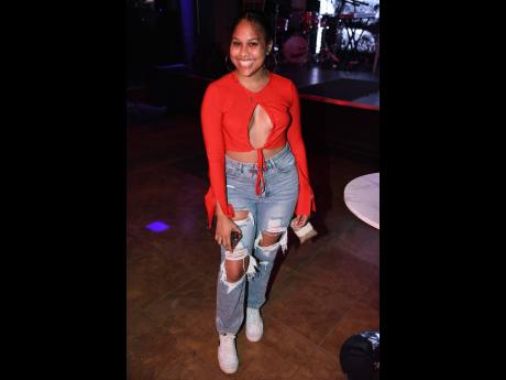 The red-hot Aleyah Cooke flashes her million-dollar smile while attending Bayka’s ‘Mob Ties’ listening party, held last Thursday at The Balcony in New Kingston.   