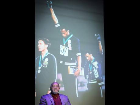 Credit: AP American former track and field athlete Tommie Smith attends a conference at the Immigration Museum yesterday in Paris. Smith and John Carlos gave a black-gloved salute on the medal stand at the 1968 Olympics in Mexico City.