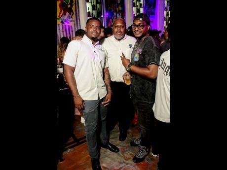 Attorney-at-law Demetrie Adams (left),  Gary Walters, senior projects manager at the National Water Commission (centre), and DJ Vinci paused their convo for a quick pic. 