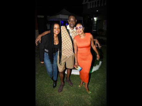 Man of the moment Bounty Killer shares lens time with Pashon Minott (left) and Lena British. 