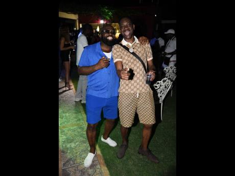 Richie Stephens (left), the host of the birthday party, having a good time with his friend Bounty Killer.
