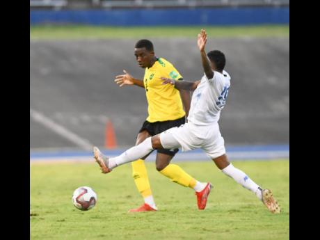 Wesley Harding (left) in action for Jamaica against Panama during a Concacaf World Cup qualifier at the National Stadium in September 2021.