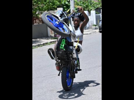 Credit: Rudolph Brown Amputee Rieanna ‘Goodas Stunts’ Wallace showcases her skills on a motorcycle.