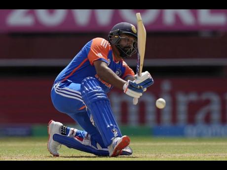India’s captain Rohit Sharma plays a shot during the ICC men’s T20 World Cup’s second semi-final between India and England at the Guyana National Stadium yesterday. 