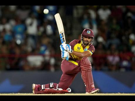 West Indies’ Nicholas Pooran bats against Afghanistan during an ICC Men’s T20 World Cup match at the Daren Sammy National Cricket Stadium in Gros Islet, Saint Lucia, on Monday, June 17. Pooran made 98.