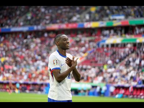 Randal Kolo Muani celebrates after France scored  during a round-of-16 match between France and Belgium at the Euro 2024 football tournament in Duesseldorf, Germany, yesterday.