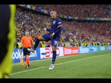 Netherlands’ Donyell Malen (18) celebrates after scoring his side’s third goal during a round-of-16 match between Romania and the Netherlands at the Euro 2024 football tournament in Munich, Germany,  yesterday.