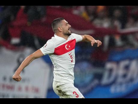 Turkey’s Merih Demiral celebrates after scoring his side’s second goal during a round-of-16 match between Austria and Turkey at the Euro 2024  football tournament in Leipzig, Germany, yesterday.