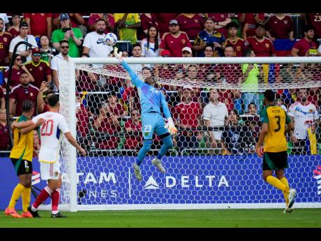 Jamaica’s goalkeeper Jahmali Waite deflects a shot by Venezuela during a Copa America Group B match between Jamaica and Venezuela, Sunday, June 30, 2024, in Austin, Texas. 