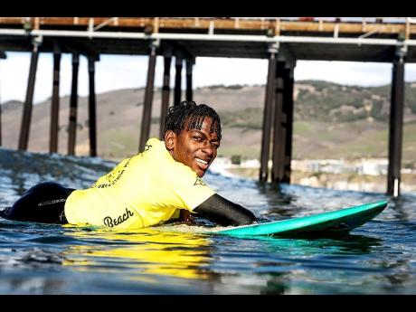 Credit: Contributed Bailey was reluctant to take up surfing because of his physical challenges, but gave it a try.