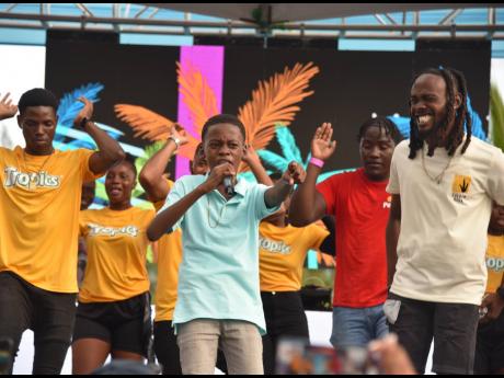 Laa Lee (right) looks on as Dwight ‘DJ Brainz’ Francis performed for the Sumfest Family Fun Day audience. 