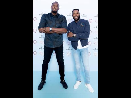 Usain Bolt (left) and his manager Nugent ‘NJ’ Walker.