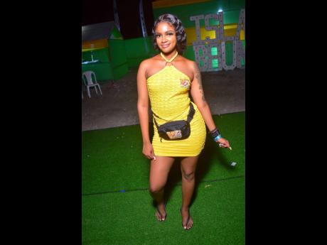 Chrissy took time from her busy bottle service duties at Island Brunch party to take a pic. The event was held on the weekend on Port Henderson Road, Portmore, St Catherine.