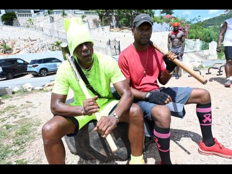 From left: Nitty Kutchie and O’Neil ‘Cashboss’ Clarke share a pose before they get into their workout regime.