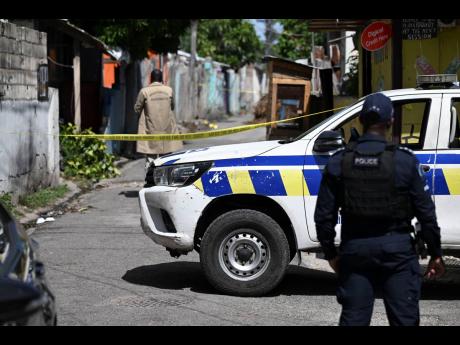Credit: Ricardo Makyn Police on a crime scene in Craig Town, last month.