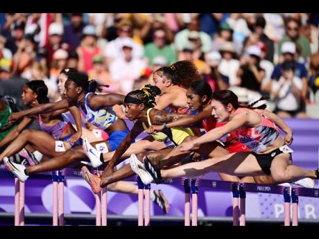 Credit: Gladstone Taylor Janeek Brown (centre) fighting for ascendency in a stacked women’s 100-metre hurdles heats at the Paris Olympics at Stade de France in Paris, France.
