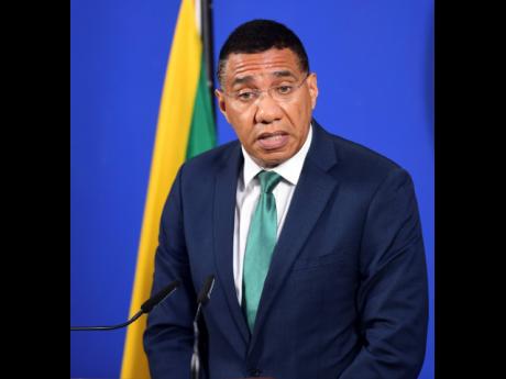 Credit: Antoine Lodge Prime Minister Andrew Holness speaking at a press conference following the massacre in Clarendon.