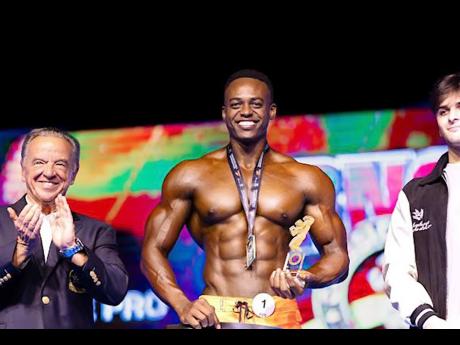 Daniel Haughton being congratulated after winning an award.