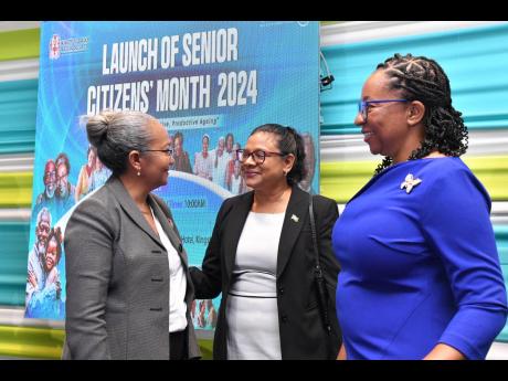 Credit: Contributed Permanent Secretary in the Ministry of Labour and Social Security, Collette Roberts Risden (left), converses with Chief Medical Officer, Dr Jacquiline Bisasor McKenzie (centre), and National Council for Senior Citizens Board Chair, Julian McKoy Davis, during the launch of Senior Citizens Month on Wednesday at The Jamaica Pegasus hotel in New Kingston.