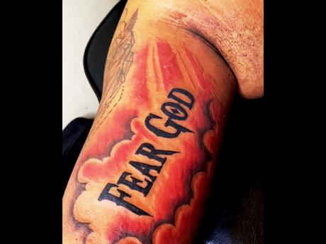 A God-centred message on one of Wilson's tattoos.