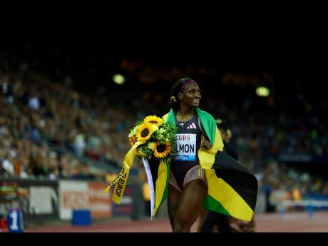 Jamaica’s Shiann Salmon celebrates after winning the 400m hurdles in a personal best 52.97 seconds at the Zurich Diamond League in Switzerland yesterday. 