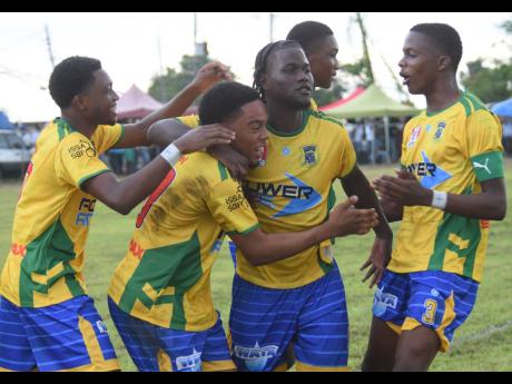 Credit: Ashley Anguin Rusea’s High players celebrate after they scored against Cambridge High during their ISSA/WATA Zone B daCosta Cup match at Collin Miller Sports Complex yesterday.