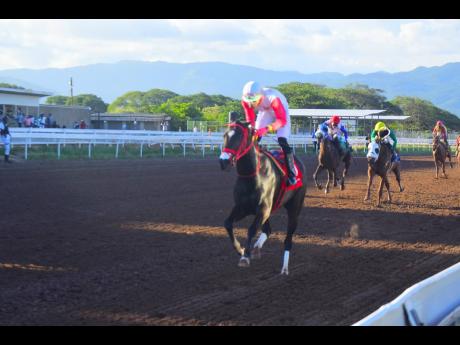 COMEHOMETOME, with Tevin Foster in the saddle winning The Winston "Fanna" Griffiths OD Classic at Caymanas Park on Sunday.