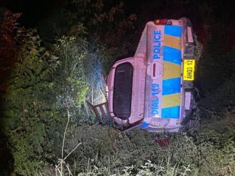 The police service vehicle that overturned along the York Town main road in Clarendon on Sunday evening.