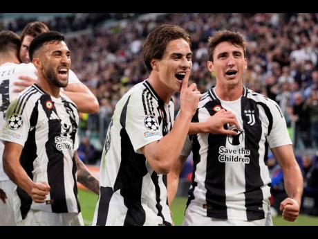 Juventus’ Kenan Yildiz (centre) celebrates after scoring the opening goal during the Champions League first phase match between Juventus and PSV Eindhoven at the Juventus stadium in Turin, Italy yesterday.