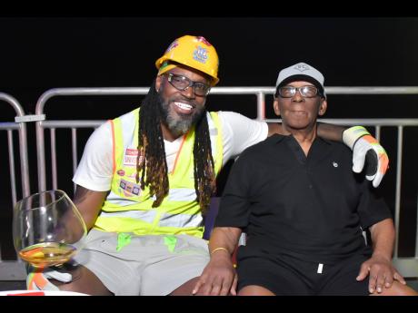 Credit: Contributed Dudley Gayle (right), 94, celebrates with his son Chris at the latter’s ‘40 Shades of Gayle’ 5.0 retro party in St Ann last weekend.