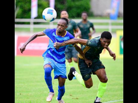 Credit: Gladstone Taylor Gladstone Taylor/Multimedia Photo Editor
Rashawn Livingston (left) of Molynes United Football Club and Roshawn Oldfield of Vere Phoenix Football Club compete for possession of the ball in the Jamaica Premier League football match at Sabina Park on Sunday. Vere Phoenix won 3-1.