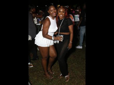 Gal pals Shaneika Reid (left) and Stacy-Ann Johnson share lens space at the epic party.