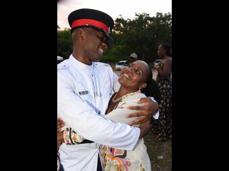 Credit: Ian Allen “I did it Mommy” is what Constable Jean-Claude Silvera (left) seems to be saying to his mother Andean Shaw as she gives him a warm hug shortly after he graduated from the National Police College of Jamaica on Thursday. Occasion was the Passing Out Parade and Awards Ceremony of Batch 155 at Twickenham Park, St Catherine.